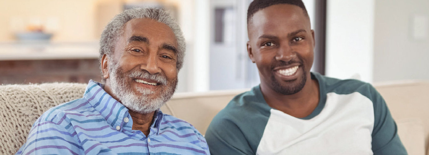 man and senior man smiling